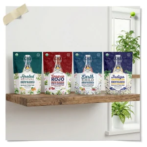 Fermentaholics Kombucha Brew Blends Bundle with Rooted Revival, Sangria Rojo, Earth Child, and Indigo Daydream flavors displayed on a shelf.