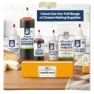 Assortment of cheese making supplies including liquid animal rennet, liquid microbial rennet, microbial rennet tablets, calcium chloride, annatto cheese color, and cheese wax displayed with assorted cheeses.